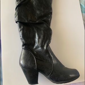 Black heeled knee-high boots